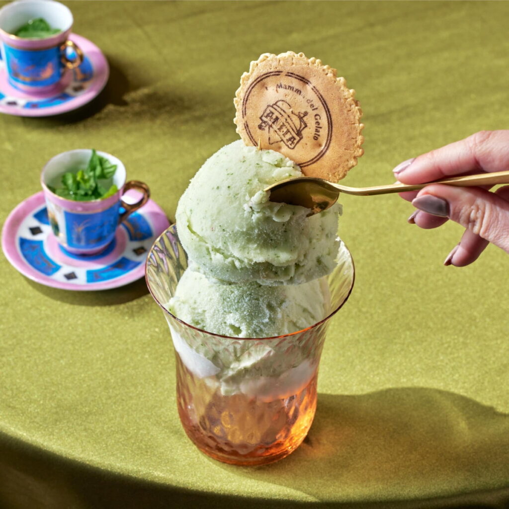 Person scooping ice cream with a spoon