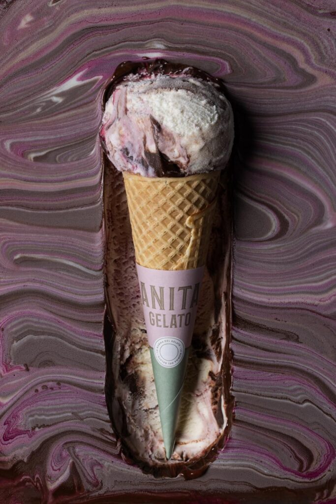 there is a chocolate ice cream cone with a green cone sticking out of it