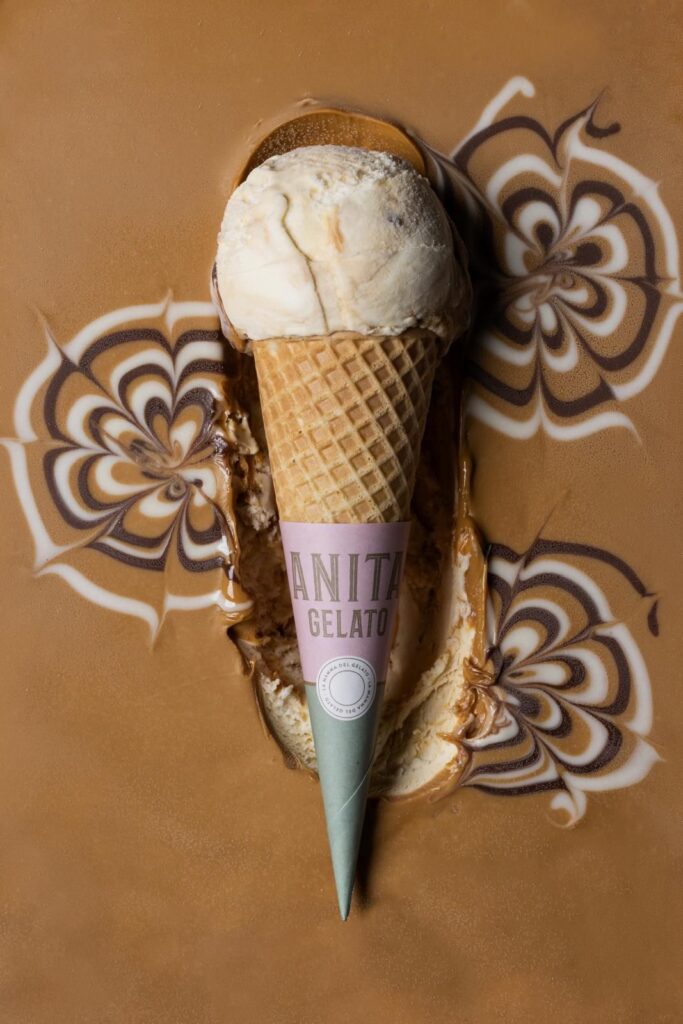 there is a ice cream cone with a scoop of ice cream on it