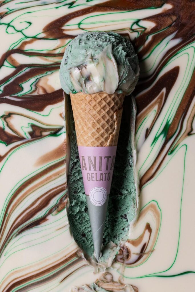 there is a green ice cream cone with a pink label on it