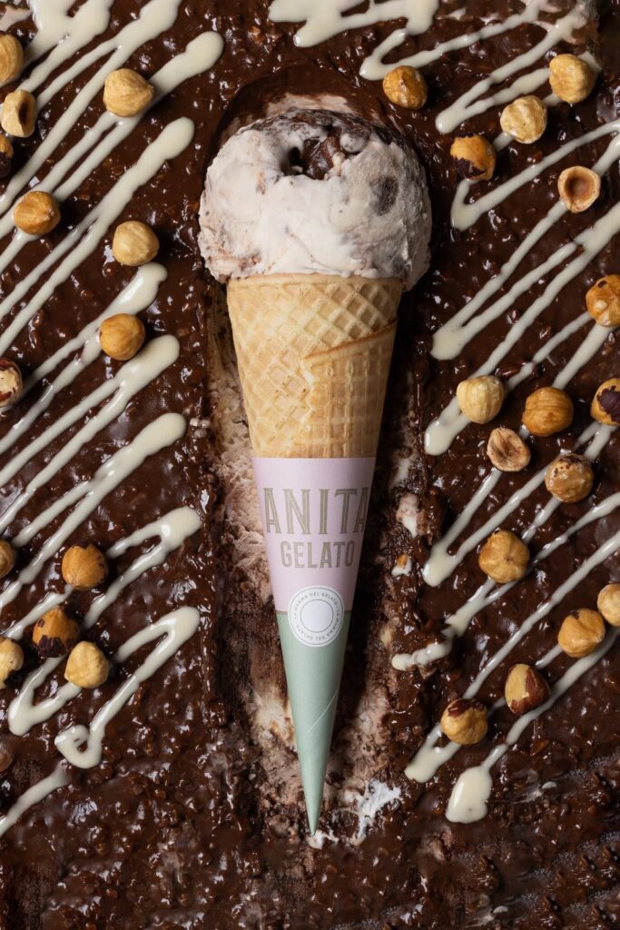there is a chocolate cake with a cone of ice cream on top