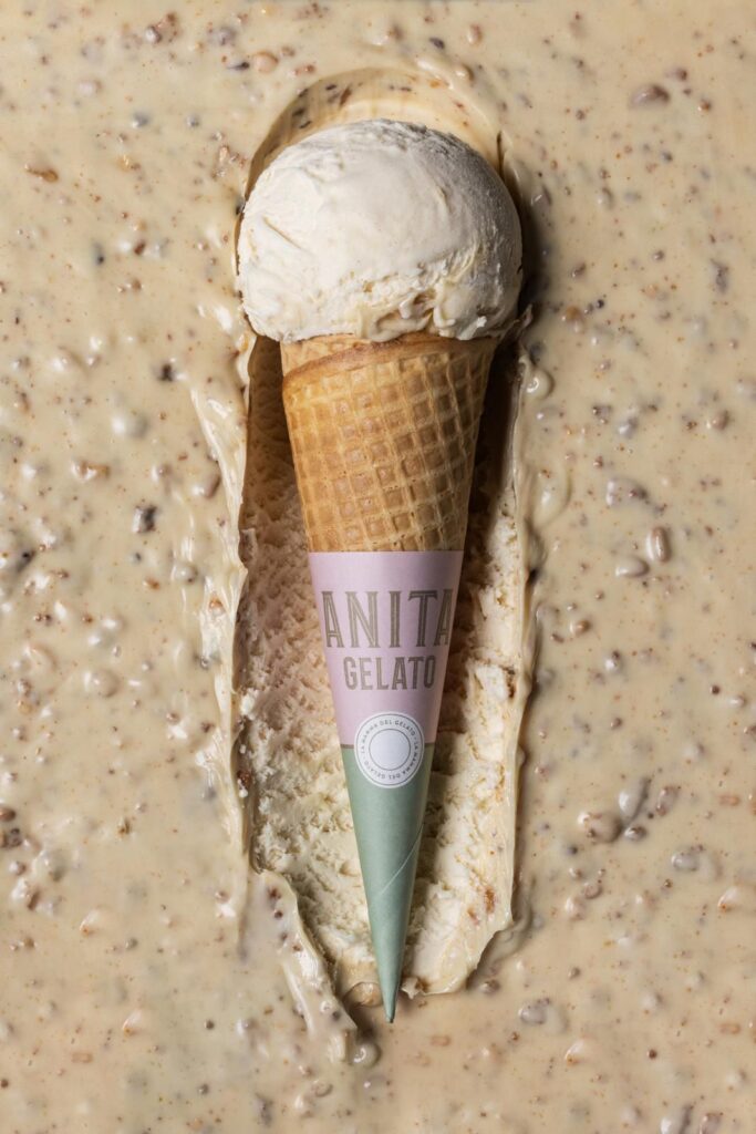 there is a cone of ice cream on a table