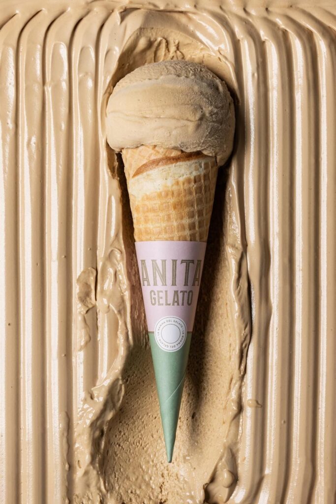 there is a cone of ice cream that is sticking out of a pan