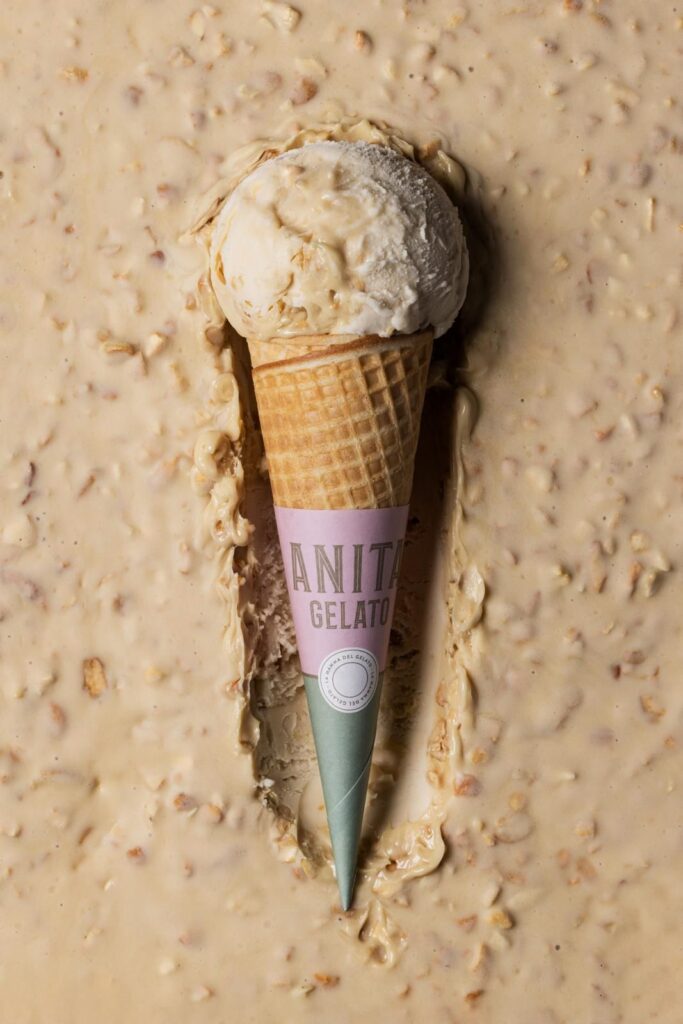 there is a cone of ice cream on a table