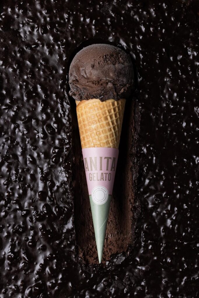 there is a chocolate ice cream cone with a pink label on it
