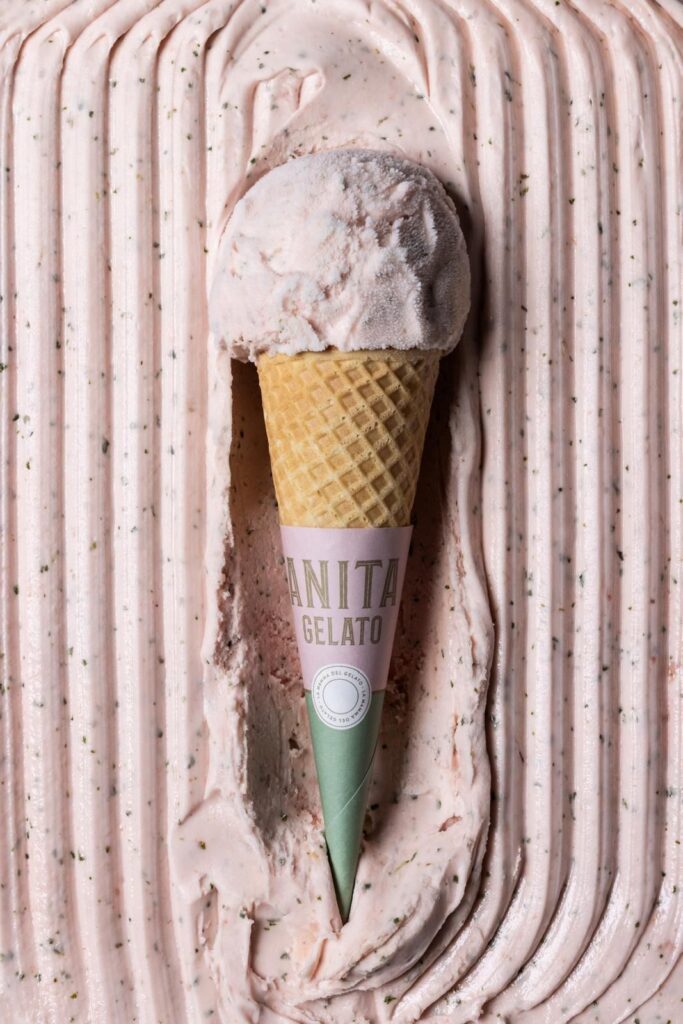 there is a ice cream cone with a cone sticking out of it
