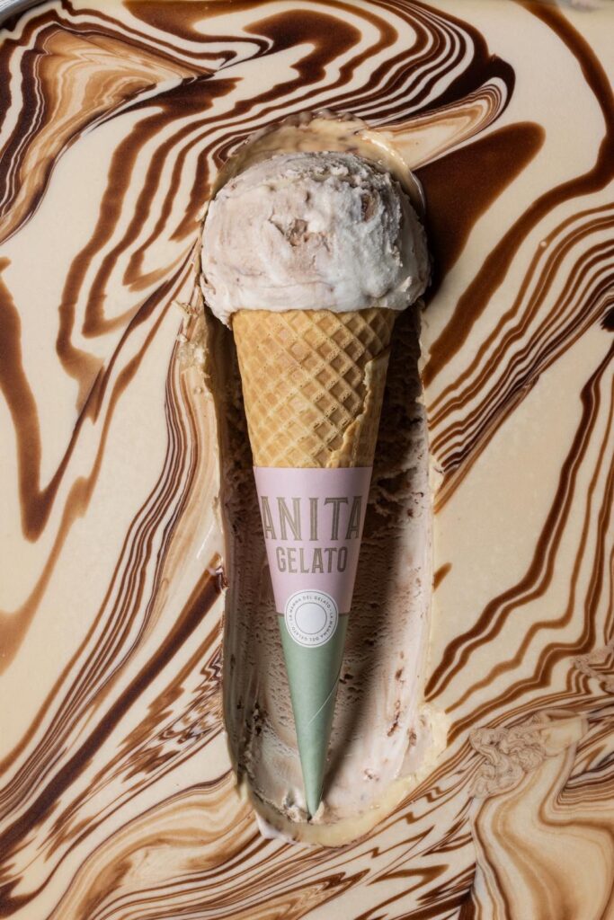 there is a ice cream cone with a scoop of ice cream in it