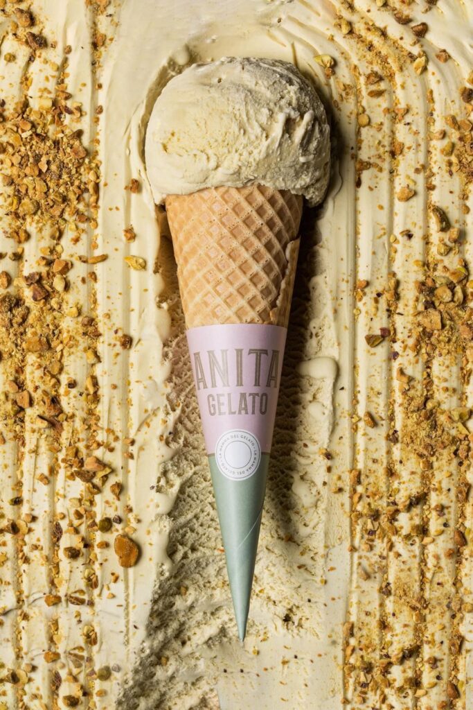 there is a scoop of ice cream in a cone on a table