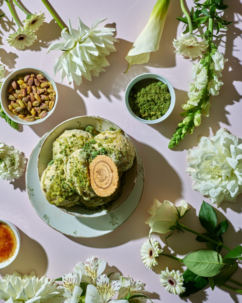 there are many different types of flowers and a bowl of food