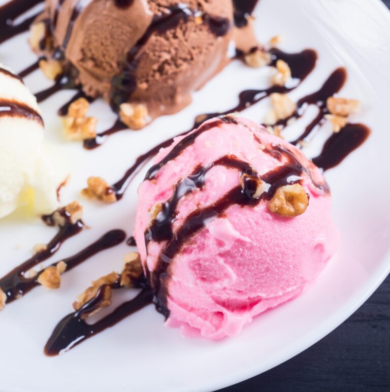 there are three scoops of ice cream on a plate