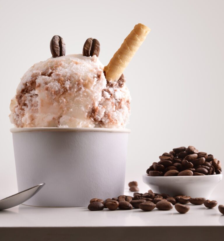 there is a cup of ice cream with a cookie stick sticking out of it