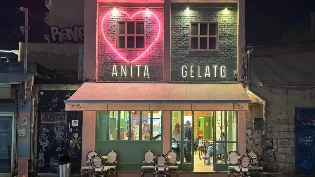 arafed building with a neon heart sign on the front of it