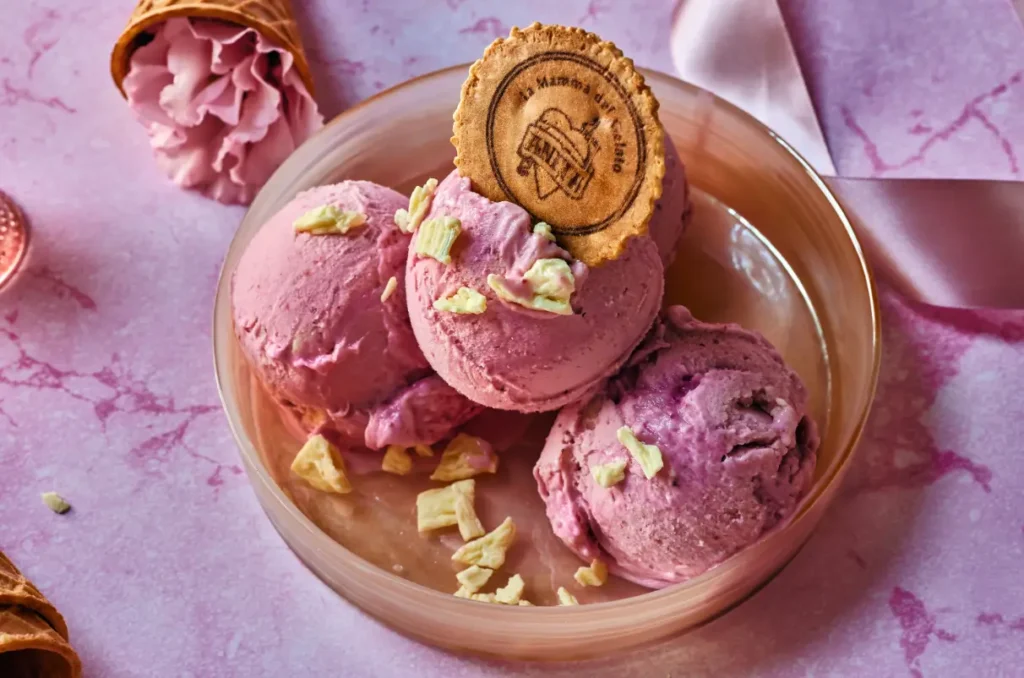 there are three scoops of ice cream in a bowl