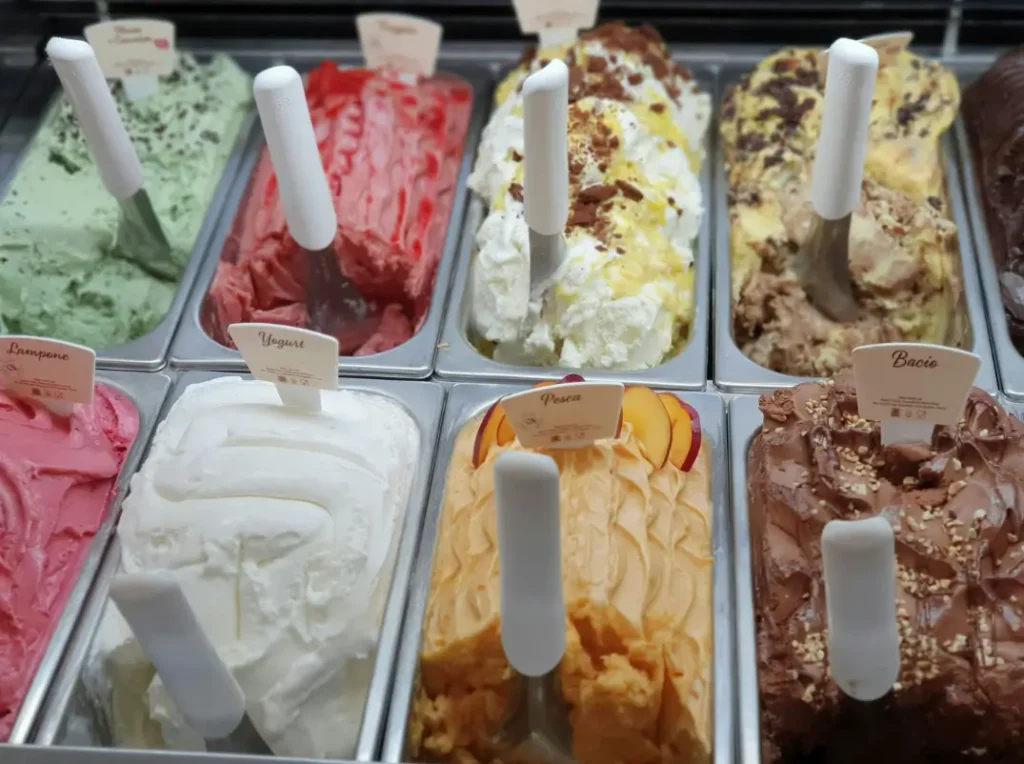 a close up of a display of different types of ice cream