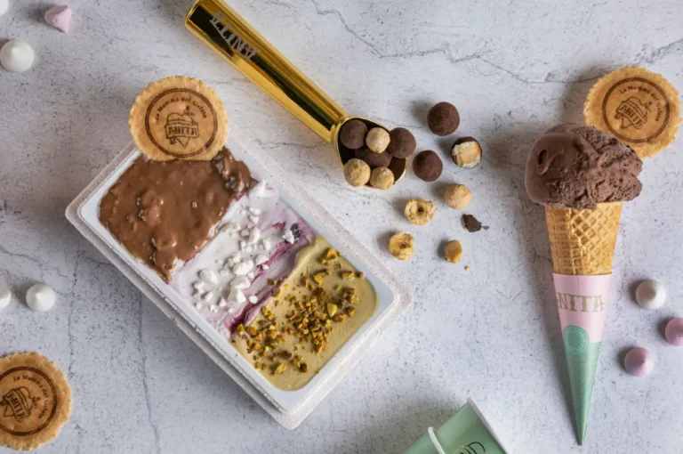 there are ice cream cones and cookies on a table