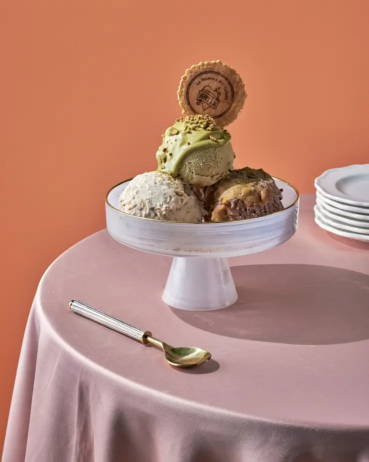 there is a cake with a cookie on top of it on a table